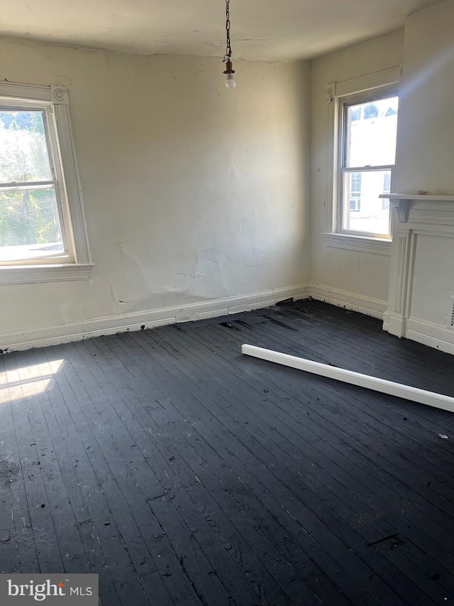 1218 Myrtle Ave, Baltimore, MD 21217 - unfurnished dining area with dark wood-style floors and healthy amount of natural light