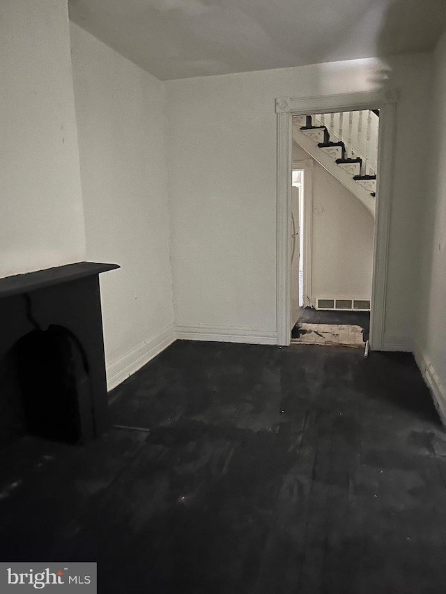 1218 Myrtle Ave, Baltimore, MD 21217 - unfurnished living room with stairway and baseboards