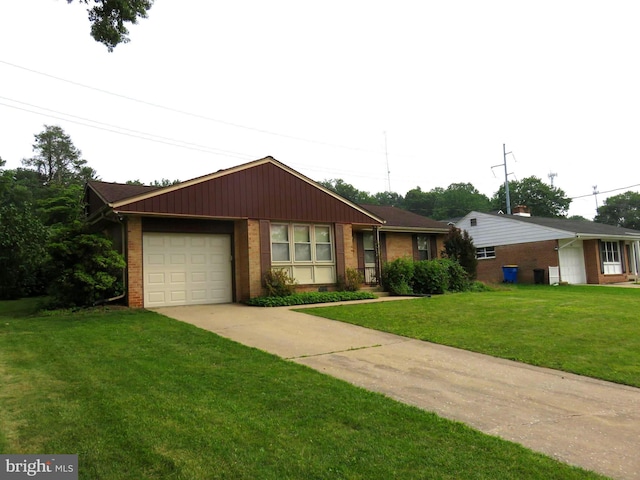 716 Hillcrest Rd, York, PA 17403 - single story home featuring brick siding, a garage, concrete driveway, and a front lawn