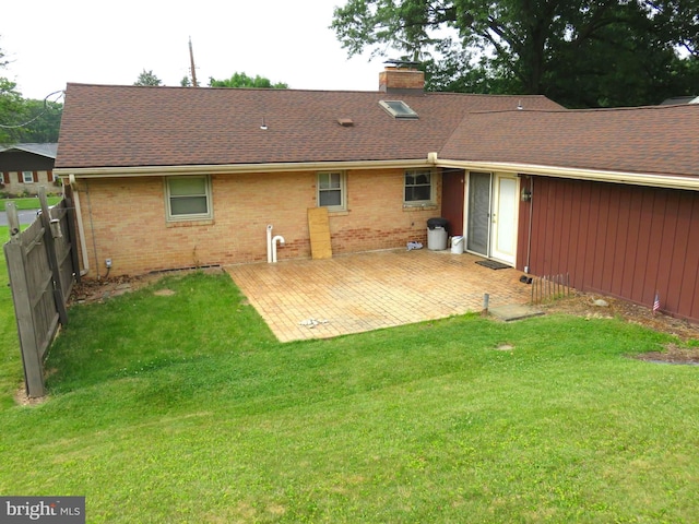 716 Hillcrest Rd, York, PA 17403 - back of house featuring a chimney, brick siding, a patio, and a shingled roof