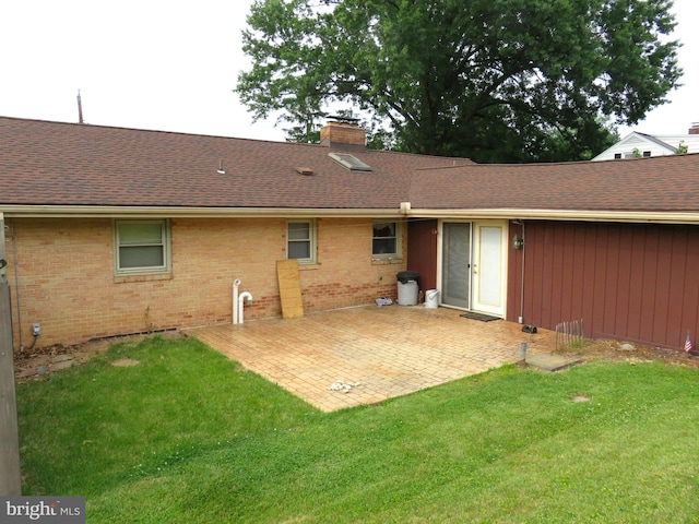 716 Hillcrest Rd, York, PA 17403 - back of house featuring a chimney, a lawn, and brick siding