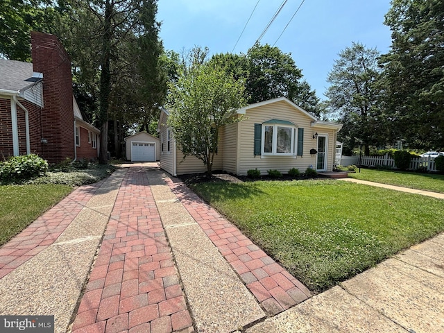 1002 Emerald, Haddon Township, NJ 08108 - view of front of home with driveway, an outdoor structure, and a detached garage