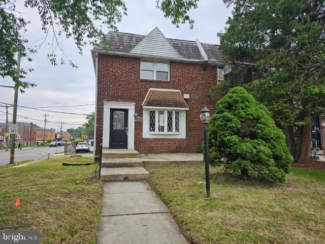 8400 Fayette St, Philadelphia, PA 19150 - view of front of property featuring brick siding and a front lawn