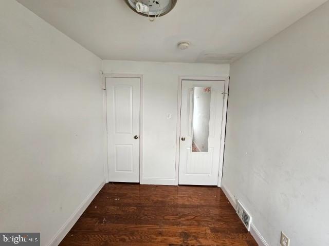 8400 Fayette St, Philadelphia, PA 19150 - empty room with wood finished floors and baseboards