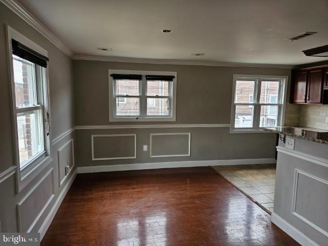 8400 Fayette St, Philadelphia, PA 19150 - unfurnished dining area with dark wood-type flooring and crown molding