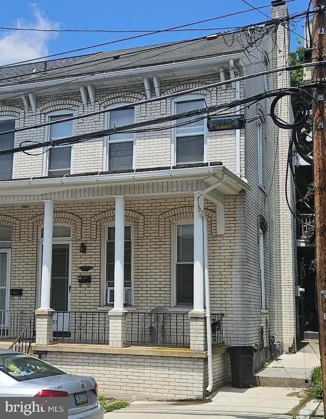 123 E Water St, Middletown, PA 17057 - view of property featuring a porch and brick siding