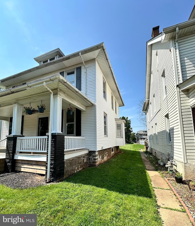 126 E Third St, Lansdale, PA 19446 - view of side of home featuring covered porch and a yard