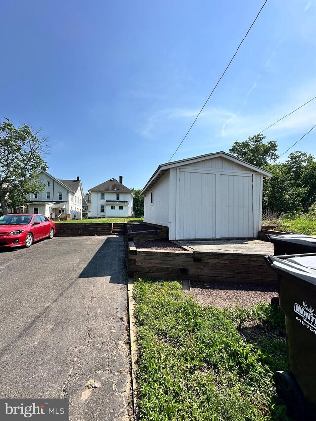 126 E Third St, Lansdale, PA 19446 - view of side of home with a storage unit and a residential view
