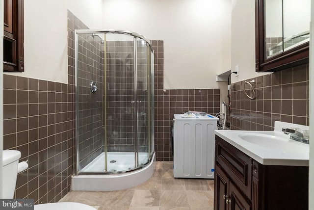 4136 Pennsgrove St, Philadelphia, PA 19104 - full bath with tile walls, a shower stall, wainscoting, and vanity
