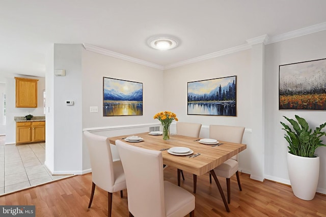 14608 Turara Ct, Haymarket, VA 20169 - dining area featuring ornamental molding and light wood finished floors