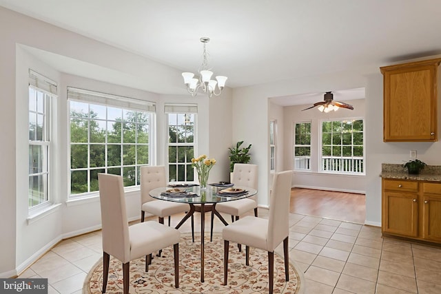 14608 Turara Ct, Haymarket, VA 20169 - dining area with healthy amount of natural light, light tile patterned floors, a chandelier, and a ceiling fan