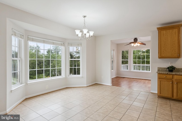 14608 Turara Ct, Haymarket, VA 20169 - unfurnished dining area featuring healthy amount of natural light, a chandelier, light tile patterned floors, and a ceiling fan