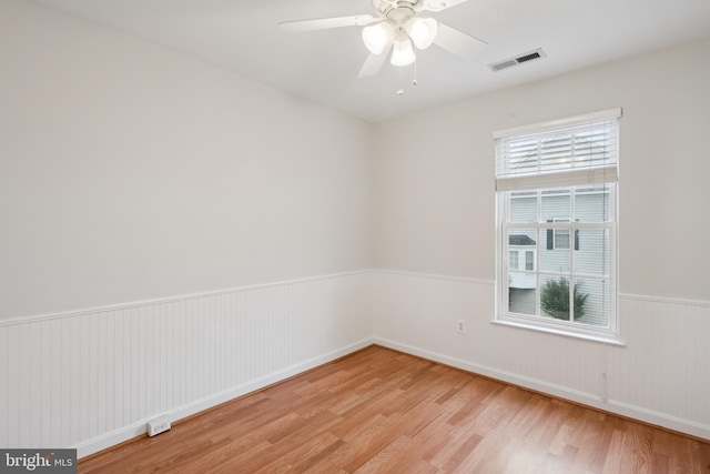 14608 Turara Ct, Haymarket, VA 20169 - unfurnished room featuring light wood-type flooring, a wainscoted wall, and a ceiling fan