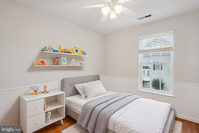 14608 Turara Ct, Haymarket, VA 20169 - bedroom with wood finished floors, wainscoting, and a ceiling fan
