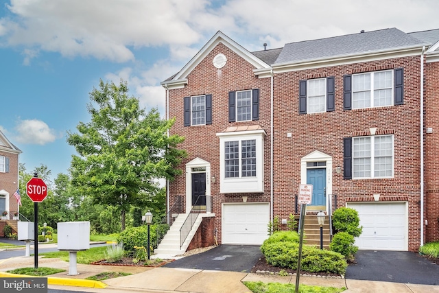 14608 Turara Ct, Haymarket, VA 20169 - view of front of property featuring asphalt driveway, an attached garage, and brick siding