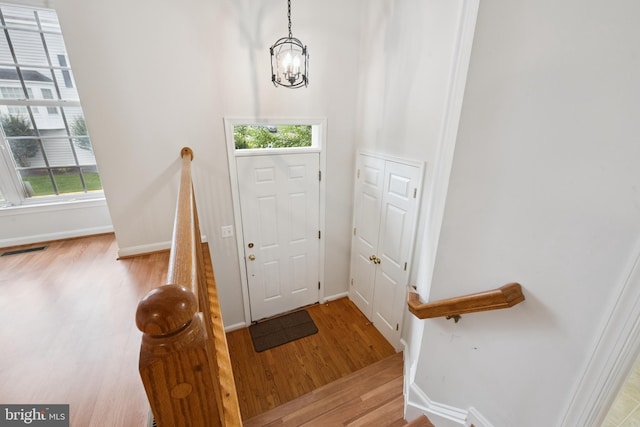 14608 Turara Ct, Haymarket, VA 20169 - foyer featuring wood finished floors and a chandelier