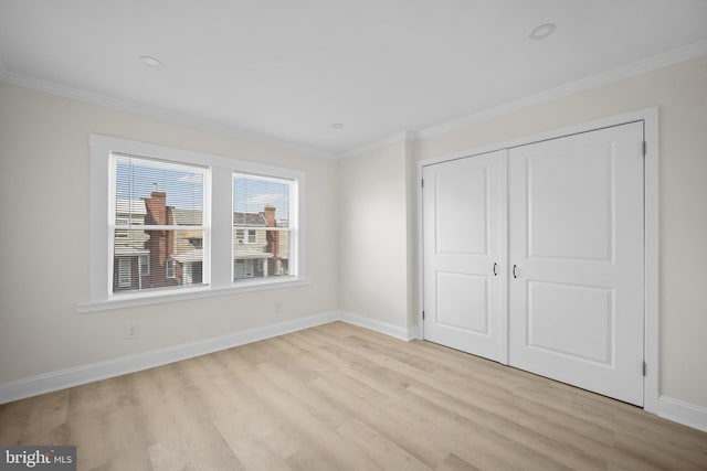 7726 Temple Rd, Philadelphia, PA 19150 - unfurnished bedroom with light wood-style flooring, ornamental molding, and a closet