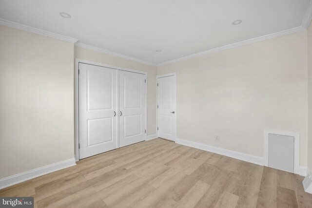 7726 Temple Rd, Philadelphia, PA 19150 - unfurnished bedroom with light wood finished floors, ornamental molding, and a closet