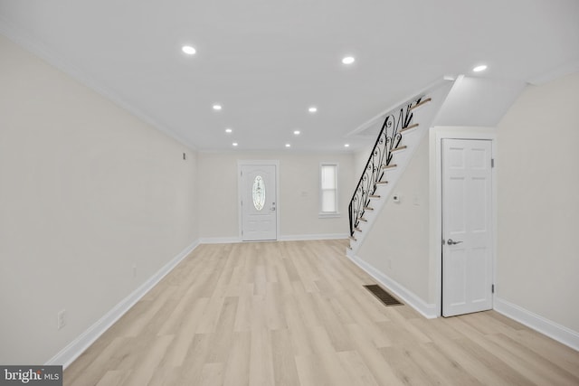7726 Temple Rd, Philadelphia, PA 19150 - entryway featuring stairs, light wood-type flooring, recessed lighting, and ornamental molding