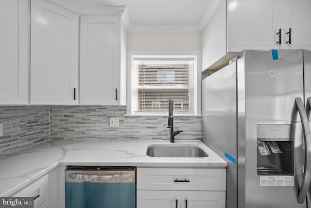 7726 Temple Rd, Philadelphia, PA 19150 - kitchen with appliances with stainless steel finishes, white cabinetry, crown molding, tasteful backsplash, and light stone counters