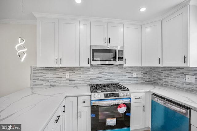 7726 Temple Rd, Philadelphia, PA 19150 - kitchen with stainless steel appliances, white cabinets, backsplash, ornamental molding, and decorative light fixtures