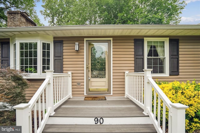 90 Scotts Cove Rd, Edgewater, MD 21037 - view of exterior entry featuring a chimney