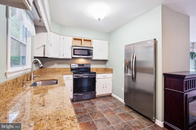90 Scotts Cove Rd, Edgewater, MD 21037 - kitchen with appliances with stainless steel finishes, white cabinetry, light stone counters, and dark stone finish flooring