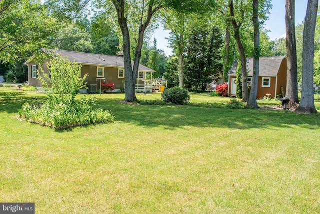 90 Scotts Cove Rd, Edgewater, MD 21037 - view of green lawn with view of wooded area and a shed