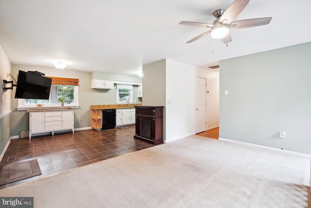 90 Scotts Cove Rd, Edgewater, MD 21037 - unfurnished living room featuring ceiling fan, dark tile patterned floors, and dark carpet