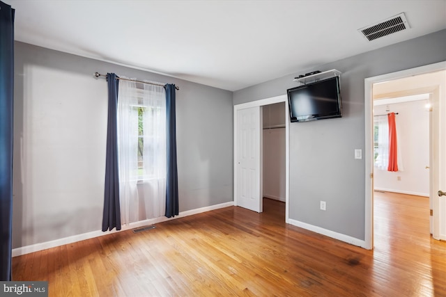 90 Scotts Cove Rd, Edgewater, MD 21037 - unfurnished bedroom featuring wood finished floors and a closet