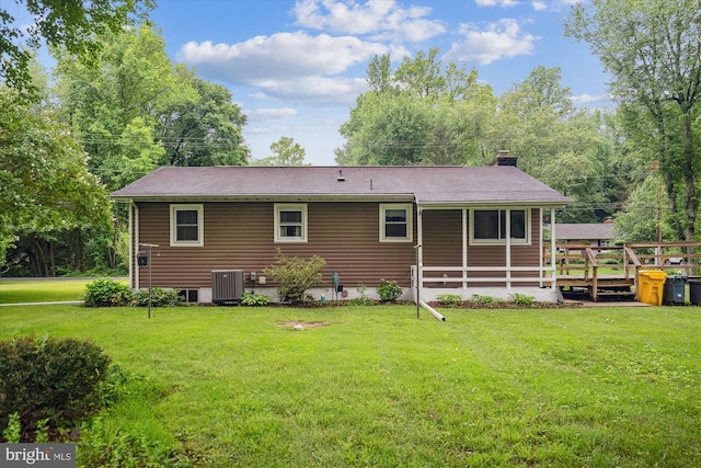 90 Scotts Cove Rd, Edgewater, MD 21037 - rear view of house featuring a chimney and a lawn
