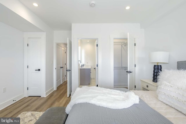 424 Taylor St NW Unit B, Washington, DC 20011 - bedroom featuring wood finished floors, connected bathroom, and recessed lighting