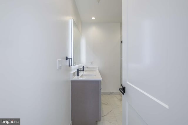 424 Taylor St NW Unit B, Washington, DC 20011 - full bathroom with marble look tiles, double vanity, and recessed lighting