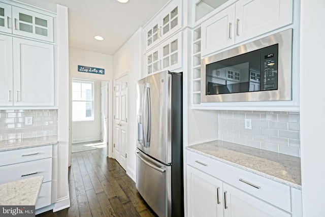 11454 Maull Rd, Lewes, DE 19958 - kitchen with stainless steel fridge, built in microwave, white cabinetry, dark wood-type flooring, and recessed lighting