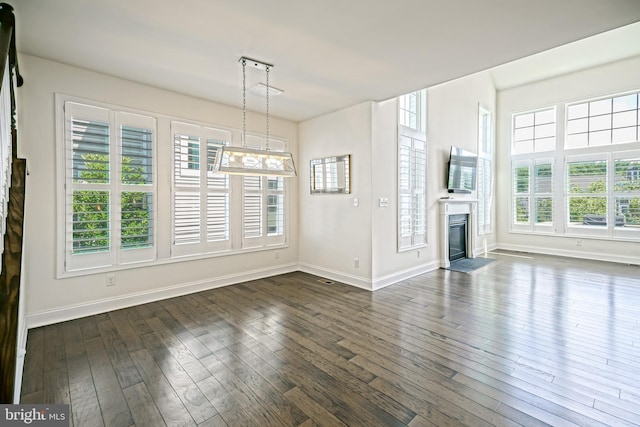 11454 Maull Rd, Lewes, DE 19958 - unfurnished living room with dark wood finished floors and a glass covered fireplace