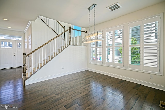 11454 Maull Rd, Lewes, DE 19958 - unfurnished living room with wood-type flooring, stairs, and ornamental molding