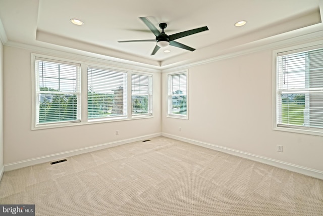 11454 Maull Rd, Lewes, DE 19958 - spare room with a raised ceiling, light colored carpet, a ceiling fan, recessed lighting, and ornamental molding