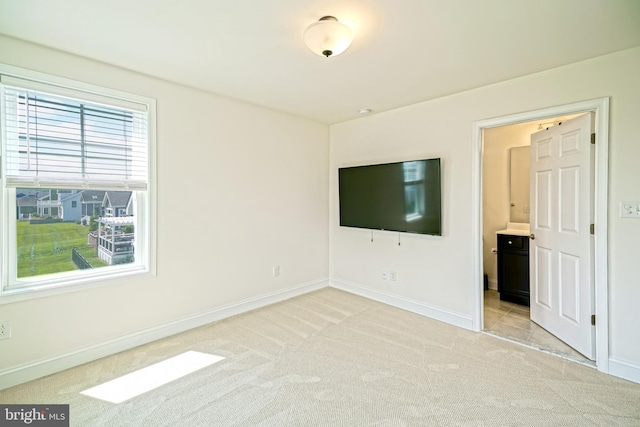 11454 Maull Rd, Lewes, DE 19958 - unfurnished bedroom with light colored carpet and connected bathroom
