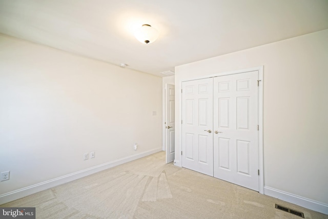 11454 Maull Rd, Lewes, DE 19958 - unfurnished bedroom featuring a closet and light carpet