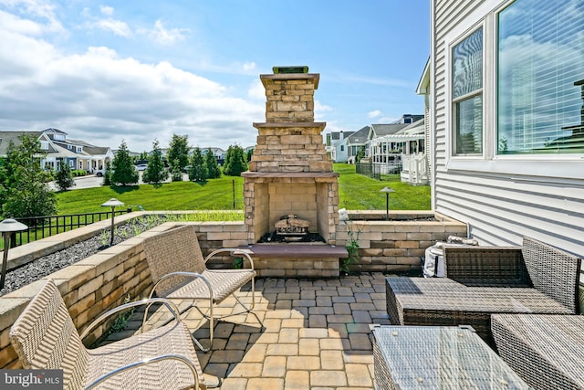 11454 Maull Rd, Lewes, DE 19958 - view of patio with an outdoor stone fireplace and a residential view