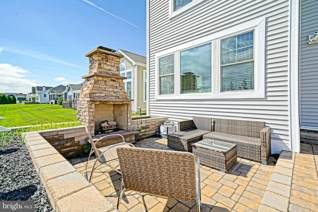 11454 Maull Rd, Lewes, DE 19958 - view of patio featuring an outdoor living space with a fireplace and a residential view