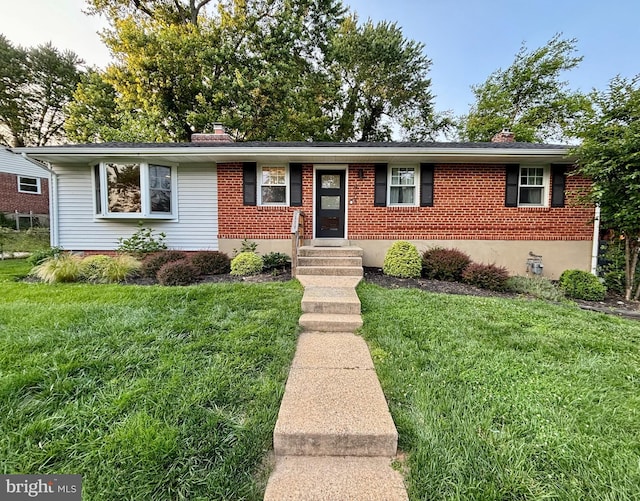 4603 Coachway Dr, Rockville, MD 20852 - ranch-style house featuring a chimney, a front lawn, and brick siding