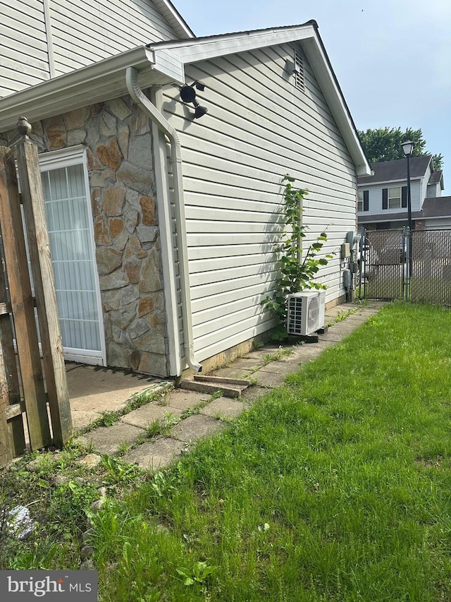 400 Calburn Ct, Bear, DE 19701 - view of side of home with an ac unit and stone siding