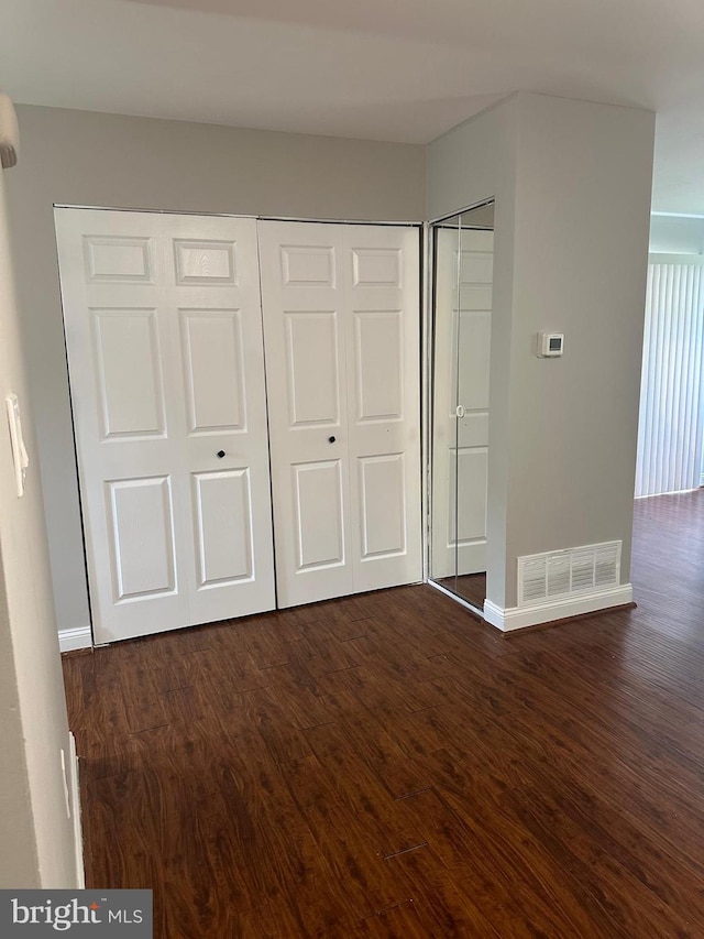 400 Calburn Ct, Bear, DE 19701 - unfurnished bedroom with dark wood-style floors and baseboards