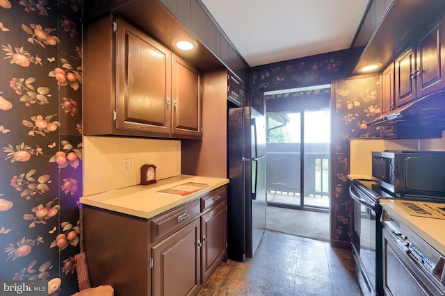 312 Skyline Dr, Reading, PA 19606 - kitchen with black appliances, light countertops, and wallpapered walls