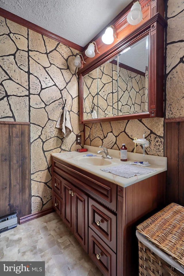 312 Skyline Dr, Reading, PA 19606 - bathroom featuring vanity, a textured ceiling, and ornamental molding