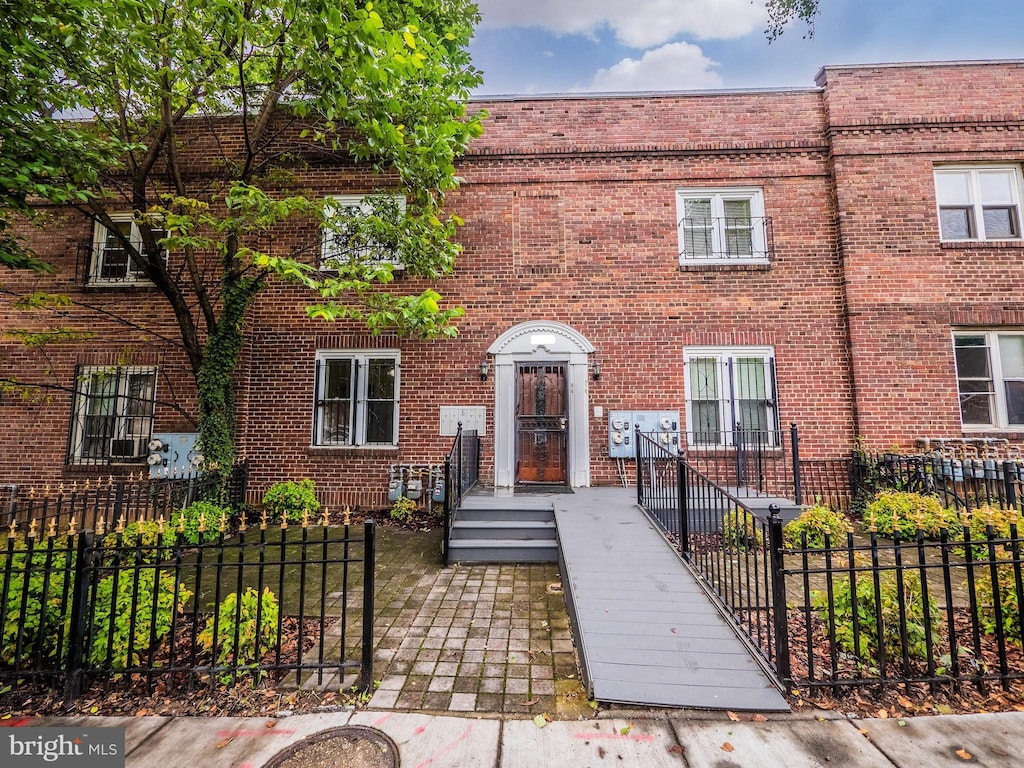 1721 Capitol Ave NE, Washington, DC 20002 - view of property with a fenced front yard and brick siding