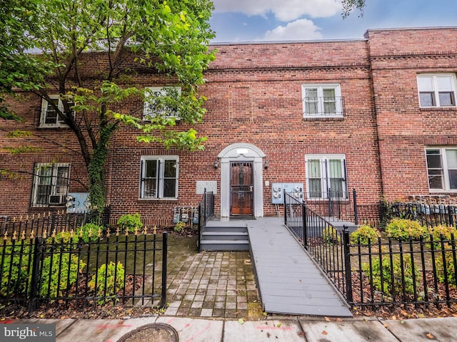 1721 Capitol Ave NE, Washington, DC 20002 - view of property with a fenced front yard and brick siding