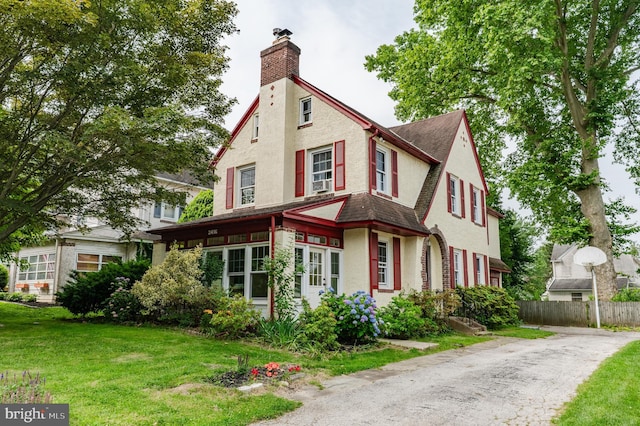 2416 Whitby Rd, Havertown, PA 19083 - view of front of property with a chimney, stucco siding, and roof with shingles