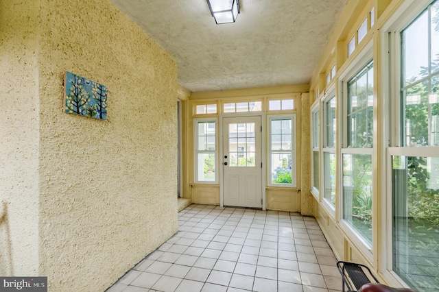 2416 Whitby Rd, Havertown, PA 19083 - unfurnished sunroom with tile patterned floors, plenty of natural light, and french doors